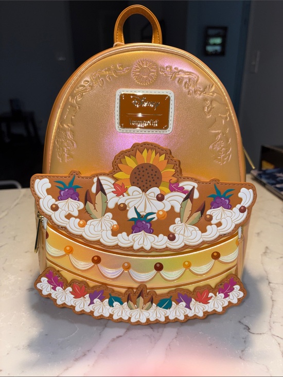 Loungefly Handbags - Loungefly Pocahontas Iridescent Orange Sunflower Cake Backpack